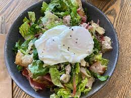 Fresh salad bowl with poached egg on top from The DOB on King William cafe.